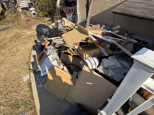 Junk pile ready for pickup at residential property