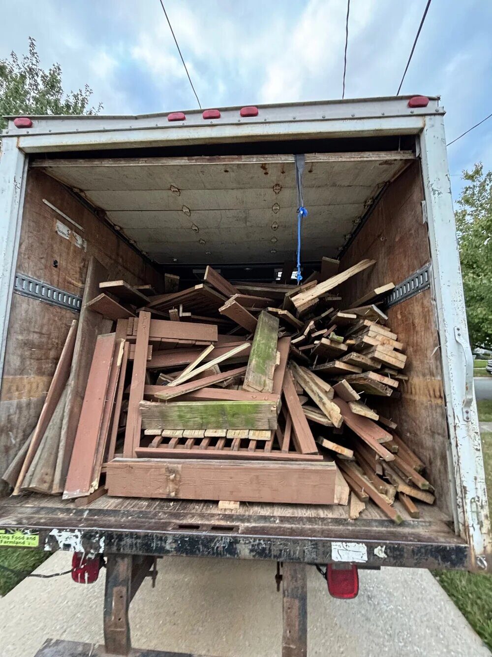 Truck loaded with deck demolition lumber